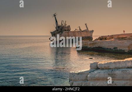 View of abandoned ship wreck EDRO III in Pegeia, Paphos, Cyprus. The rusty shipwreck is stranded on Peyia rocks at kantarkastoi sea caves, Coral Bay, Stock Photo