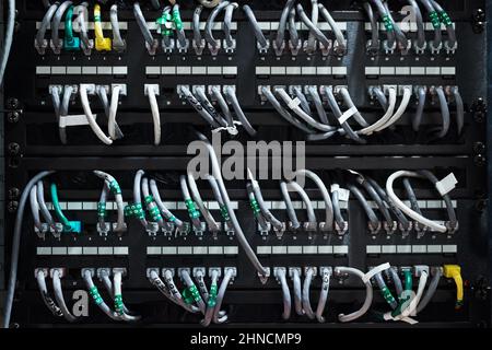 Complicated yet efficient. Cropped shot of the inside of a computer with all of its wiring located in a server room. Stock Photo
