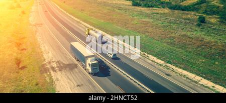 Cargo truck with container on highway aerial view. freight transportation and commercial logistic concept. copy space for text. Stock Photo