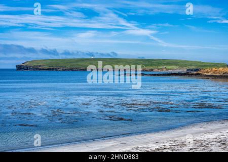 View of Brough of Birsay, an uninhabited tidal island, from Birsay Beach on Mainland Orkney in Scotland, UK Stock Photo