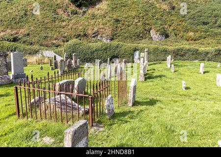 The roofless, ivy-covered chapel of St Columba in Keil Cemetery near Southend on the Kintyre Peninsula, Argyll & Bute, Scotland UK Stock Photo