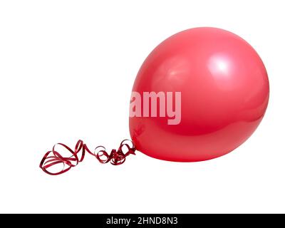 Red bright rubber balloon isolated on the white background Stock Photo