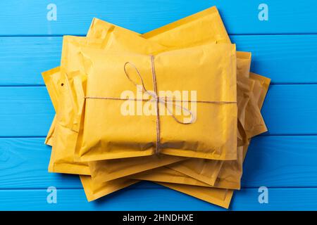 Lot of yellow paper postal envelopes. Top view. Stock Photo