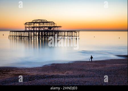 13 January 2022: Brighton, East Sussex, UK - Brighton West Pier at sunset on a clear winter afternoon, long exposure. Stock Photo