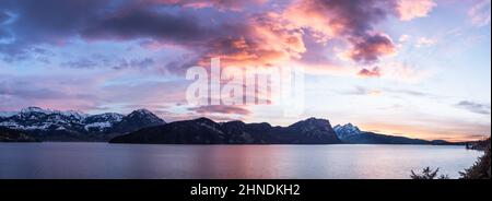 Dramatic sunset over the mountains and the lake. Switzerland. Lake Lucerne. Stock Photo