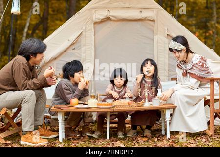 Japanese Family Eating Camping Rice Stock Photo