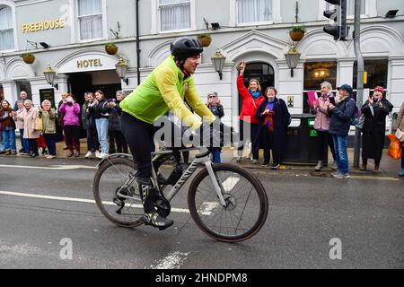 Bridport, Dorset, UK.  16th February 2022.  Olympic gold medalists Tom Daley OBE is cheered on by people lining the street as he rides through Bridport in Dorset on day 3 of his Comic Relief Hell of a Homecoming challenge from the Queen Elizabeth Olympic Park in Stratford to his hometown of Plymouth in Devon.  On this leg he is cycling 130 miles from Southampton to Bovey Castle on Dartmoor in Devon.  Picture Credit: Graham Hunt/Alamy Live News Stock Photo