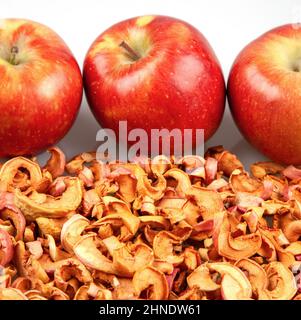 Fresh red apples on dried apple slices Stock Photo