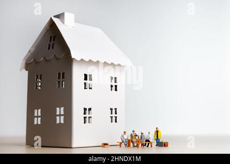 Builders having break at construction site Stock Photo