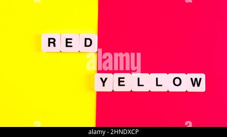 Red and Yellow. Selective focus on the tileon a yellow and red background Stock Photo