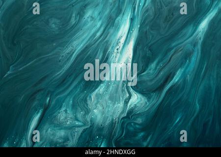 Fluid Art. Liquid dark turquoise abstract drips and wave. Marble effect background or texture. Stock Photo