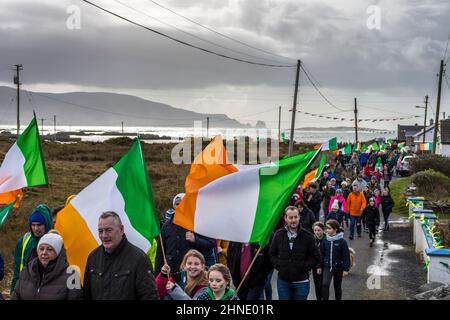 Villagers take part in St Patrick's Day parade by Atlantic Ocean coastal village of Rosbeg, County Donegal, Ireland Stock Photo