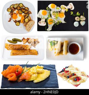 View of many plates with different food over white background Stock Photo