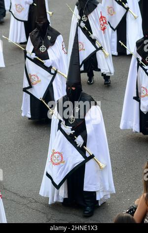 Penitent with clarinet in the Easter Week Procession of the Brotherhood of Jesus in his Third Fall on Holy Monday in Zamora, Spain. . Stock Photo