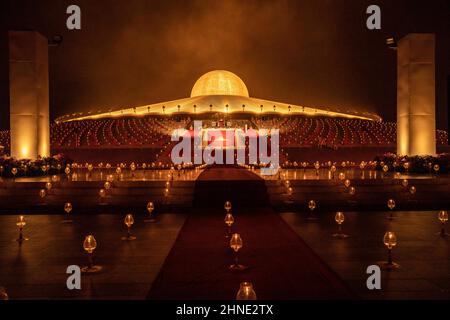 Bangkok, Thailand. 16th Feb, 2022. Candles are seen during Makha Bucha Day at Wat Phra Dammakaya in Bangkok, Thailand, Wednesday, February 16, 2022. 1000 monks participate in the ceremony and light tens of thousands of candles. (Credit Image: © Andre Malerba/ZUMA Press Wire) Stock Photo