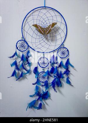 big colorful butterfly on dream catcher at home from flat angle Stock Photo