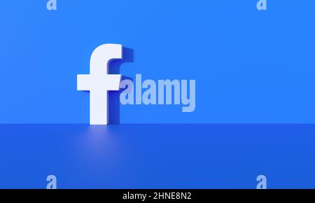 Facebook logo on blue wall background with hard shadow and space for text and graphics. 3d Rendering. Stock Photo