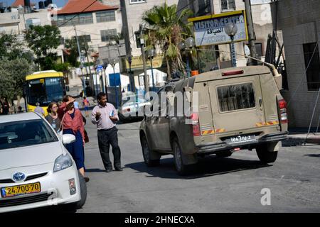Vehicle of Israeli army patrolling the streets in the West Bank Stock Photo