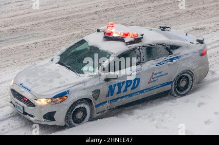 NYPD vehicle encrusted with snow on Ninth Avenue the Chelsea neighborhood of New York on Saturday January 29, 2022 during a NorÕEaster which threatens to drop up to 8 inches in the city according to some weather reports. The storm is expected to blanket the Northeast with some unlucky areas expected to receive over a foot of snow. Yikes!.  (© Richard B. Levine. Stock Photo