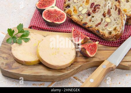 foie gras accompanied by dried fruit bread with fresh figs Stock Photo