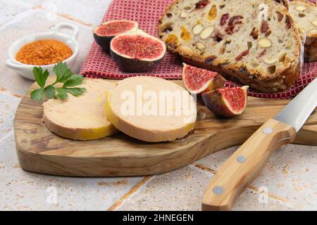 foie gras accompanied by dried fruit bread with fresh figs Stock Photo