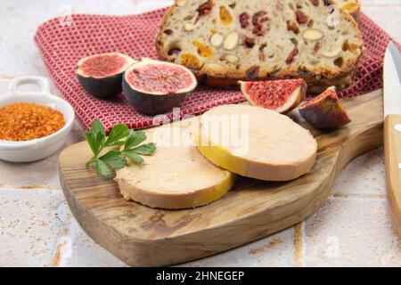 foie gras accompanied by dried fruit bread with fresh figs Stock Photo