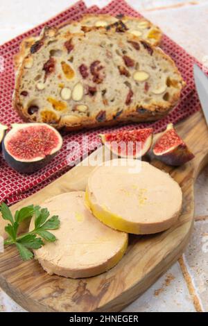 foie gras accompanied by dried fruit bread with fresh figs Stock Photo