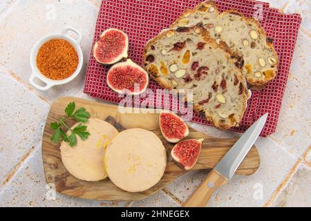 foie gras accompanied by dried fruit bread with fresh figs Stock Photo