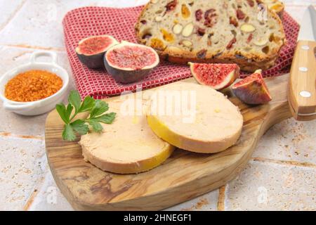 foie gras accompanied by dried fruit bread with fresh figs Stock Photo