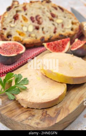 foie gras accompanied by dried fruit bread with fresh figs Stock Photo