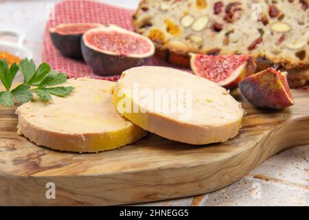 foie gras accompanied by dried fruit bread with fresh figs Stock Photo
