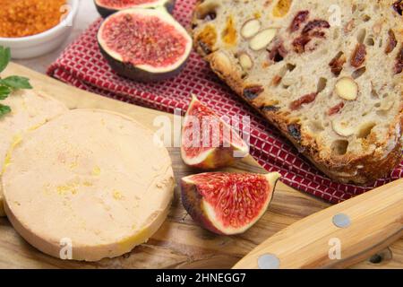 foie gras accompanied by dried fruit bread with fresh figs Stock Photo