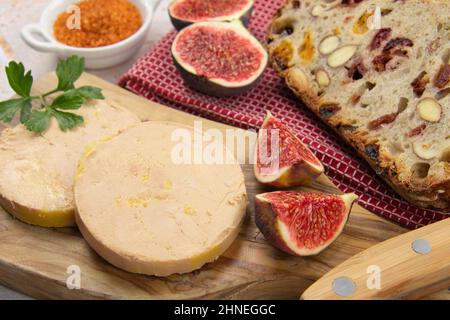 foie gras accompanied by dried fruit bread with fresh figs Stock Photo
