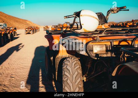 Helmet on a quad bike somewhere in the desert near Hurghada, Egypt. Taking an atv adventure tour to the desert in egypt Stock Photo