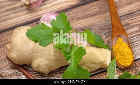 fresh ground ginger on a wooden background Stock Photo