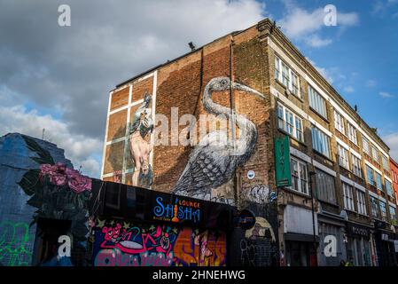 Stork Graffiti art in Hanbury Street, off Brick Lane, iconic London street, home to Bangladesh community known for its curry restaurants, now a trendy Stock Photo