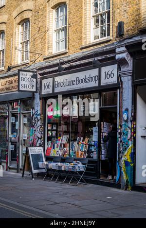 Brick Lane Bookshop in iconic London street, home to Bangladesh community known for its curry restaurants, now a trendy hipster area, Tower Hamlets, L Stock Photo