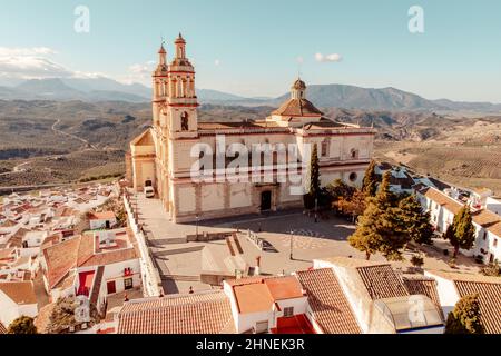 Cityscape of Olvera with the Church of Our Lady of the Incarnation in southern Spain Located on the route of the white villages Stock Photo