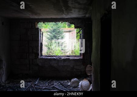 Burned out room in an abandoned sanatorium, Germany Stock Photo