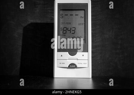 Device with lcd for monitoring home electricity usage Stock Photo
