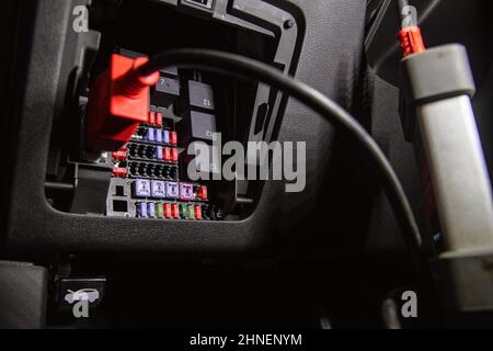 Car fuse block with a connector for computer diagnostics of car systems Stock Photo