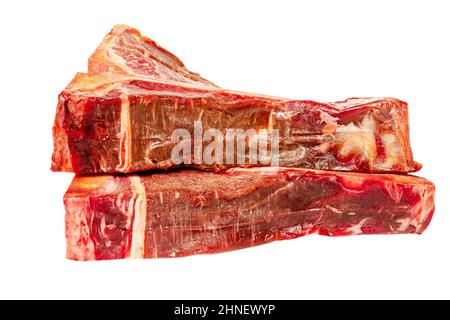 Two raw beef steaks isolated on white background. The meat is ready to cook. Stock Photo