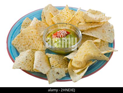 Nachos with guacamole on blue plate Stock Photo