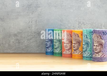 Malaysian currency, Money rolls, Ringgit banknotes lined up in a row ...