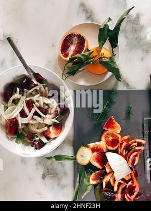 Top view of tasty winter fennel salad with blood oranges on marble ground Stock Photo