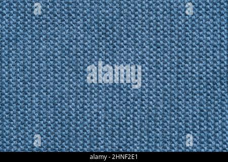 Blue knitted texture of a scarf or background of a winter sweater. Stock Photo