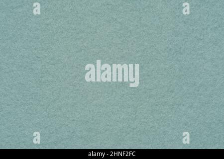 A flannelette. The backside of a knitted fabric with fleece. A napped cotton jersey fabric, light green flannel cloth. Stock Photo
