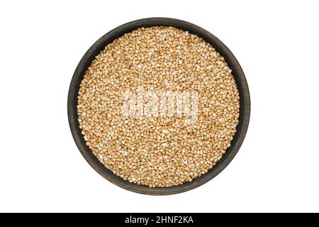 Wooden bowl of green buckwheat, gluten free organic grains. Isolated on white, view from above. Stock Photo