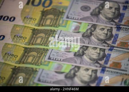 Banknotes of hundreds of US dollars and euros, trading index financial concept Stock Photo