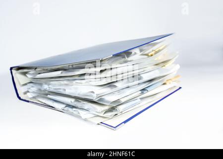 Large ring binder with clear punched pockets full of receipts, office management, accounting and tax calculation, light gray background, copy space, s Stock Photo